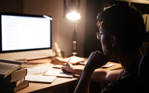 A man reading his computer.