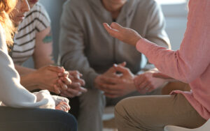 A group of people talking to one another.